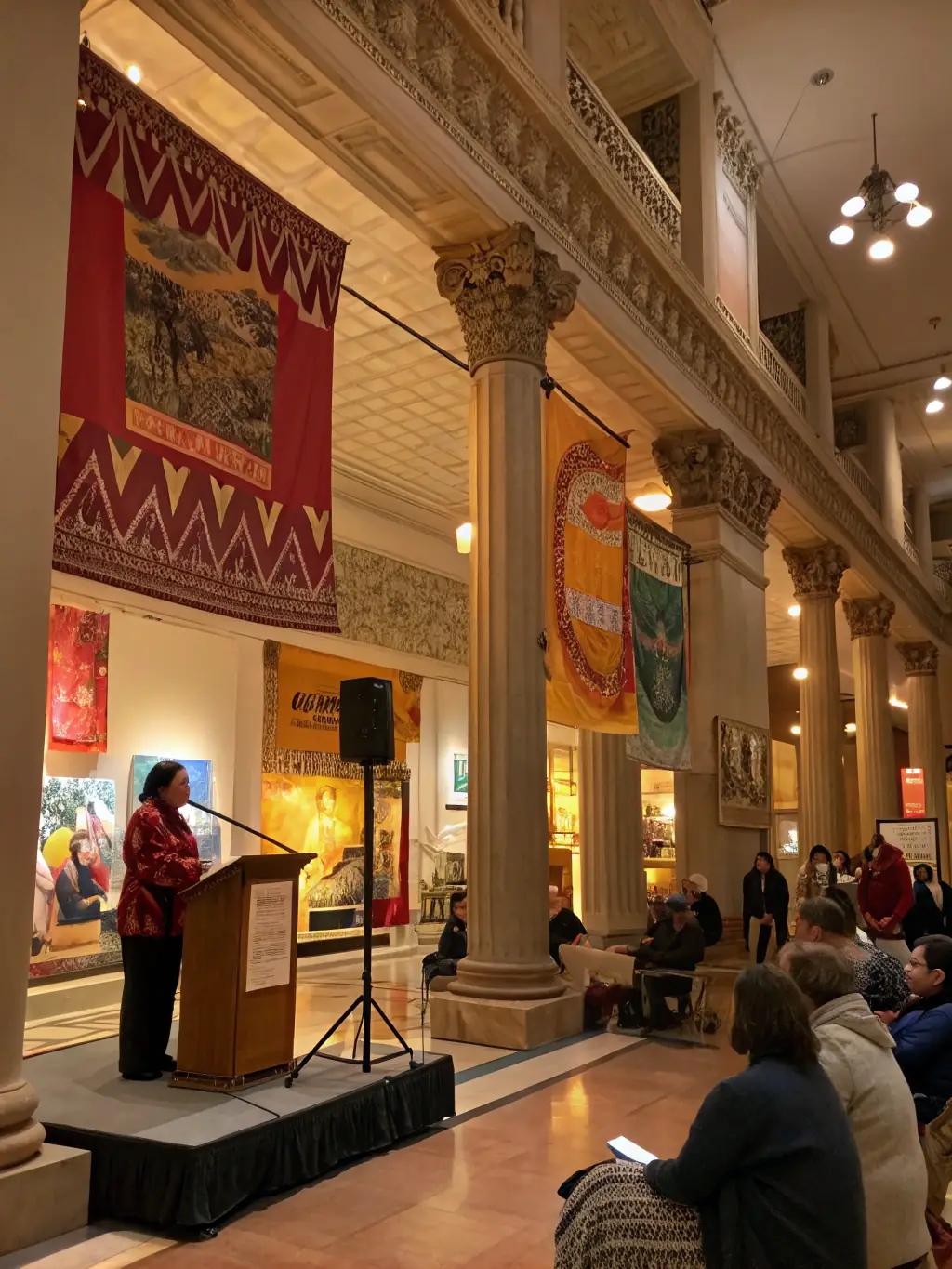 A visually appealing image showcasing a special event at the AFC Museum, such as an artist talk or a cultural performance, with attendees enjoying the experience.
